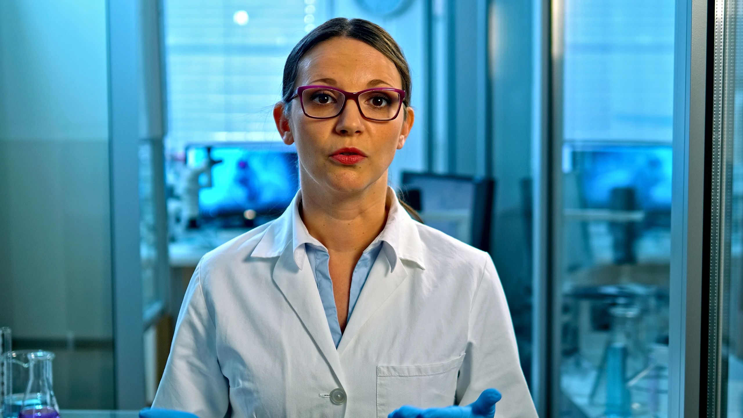 Scientist presenting findings in a high-tech lab